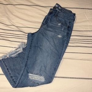 Distressed boyfriend fit jeans.